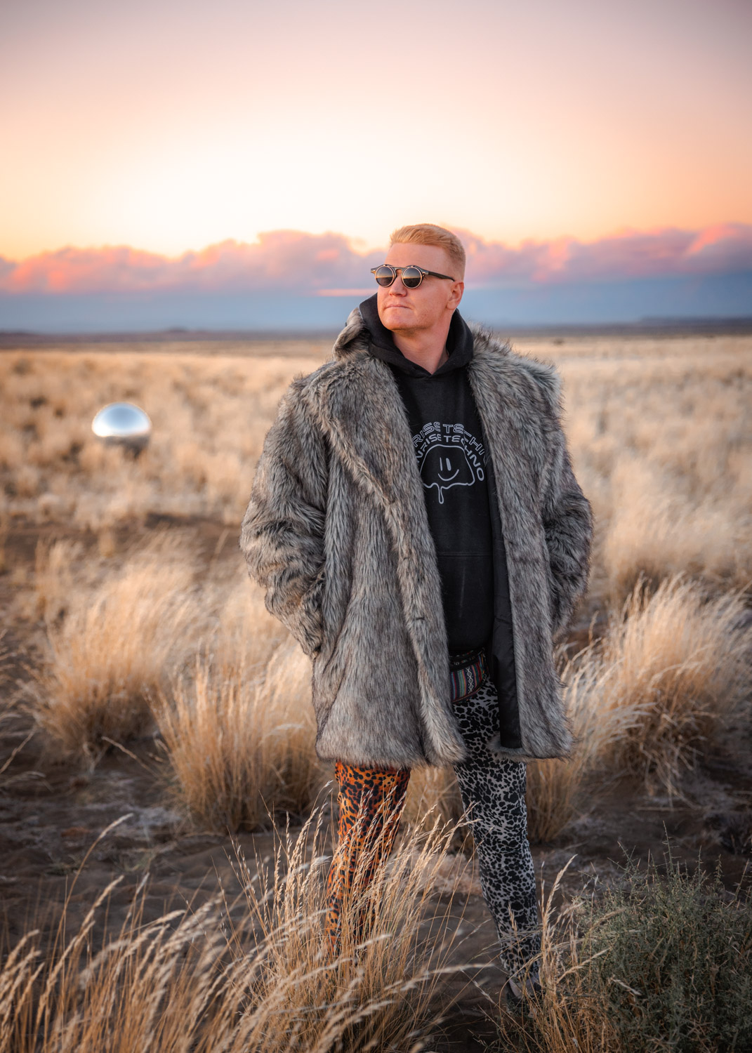 Man wearing fur coat at Burning Man
